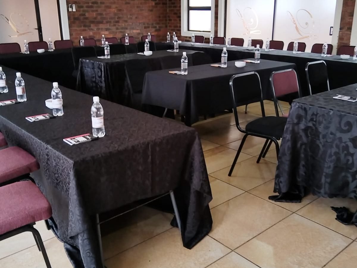Wide view of the conference hall arranged boardroom-style