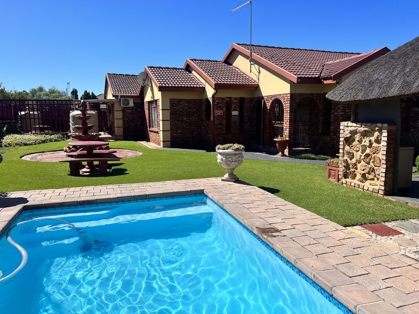 Garden and pool area at Lotlametswe B&B
